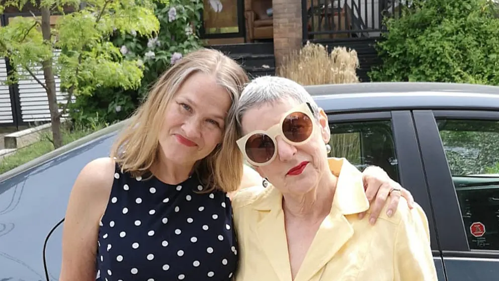 Sue Foster and Geri Rockstein smiling with their arms around each other