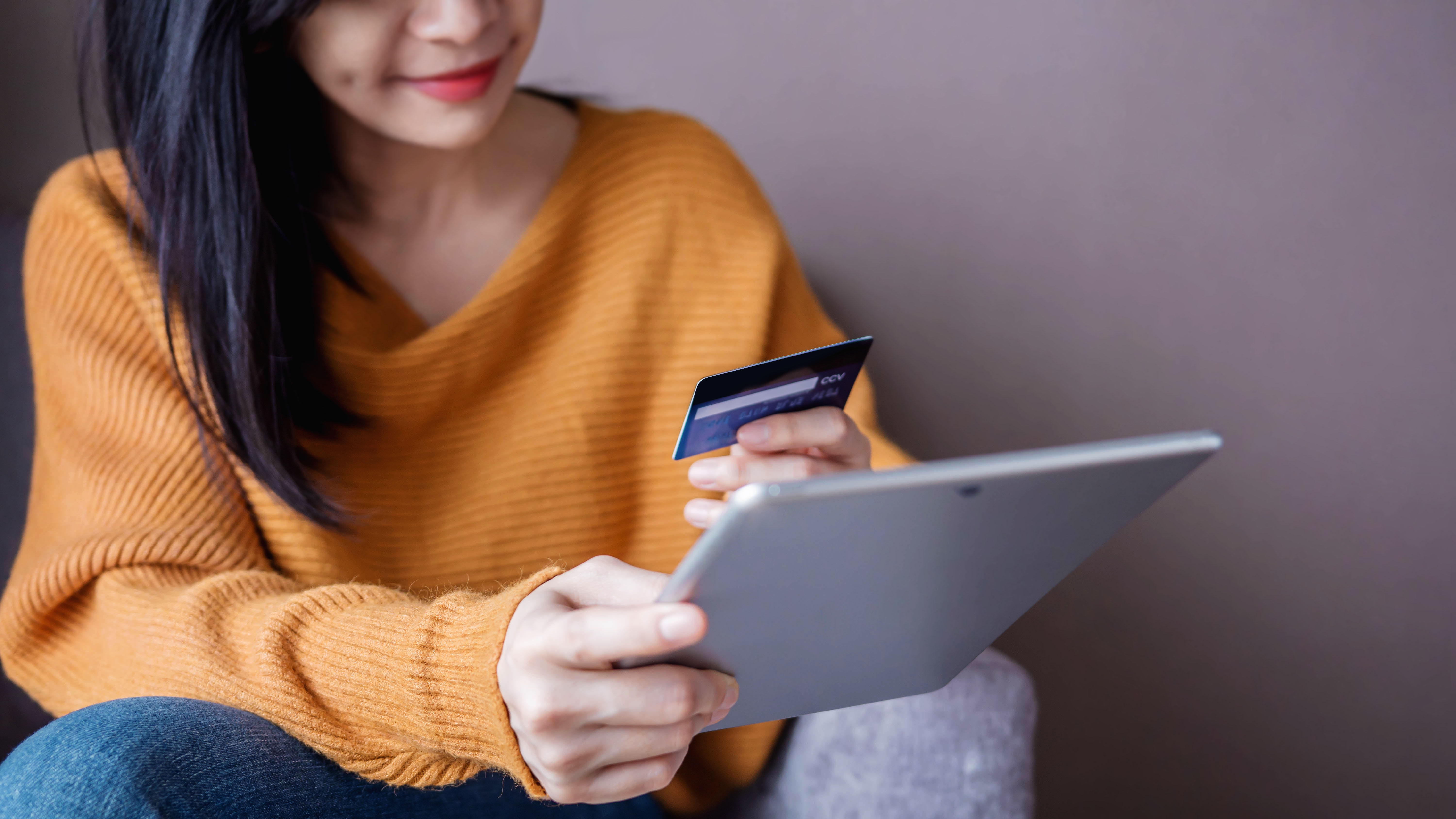 Happy Woman Customer using Credit Card and Tablet to Shopping Online