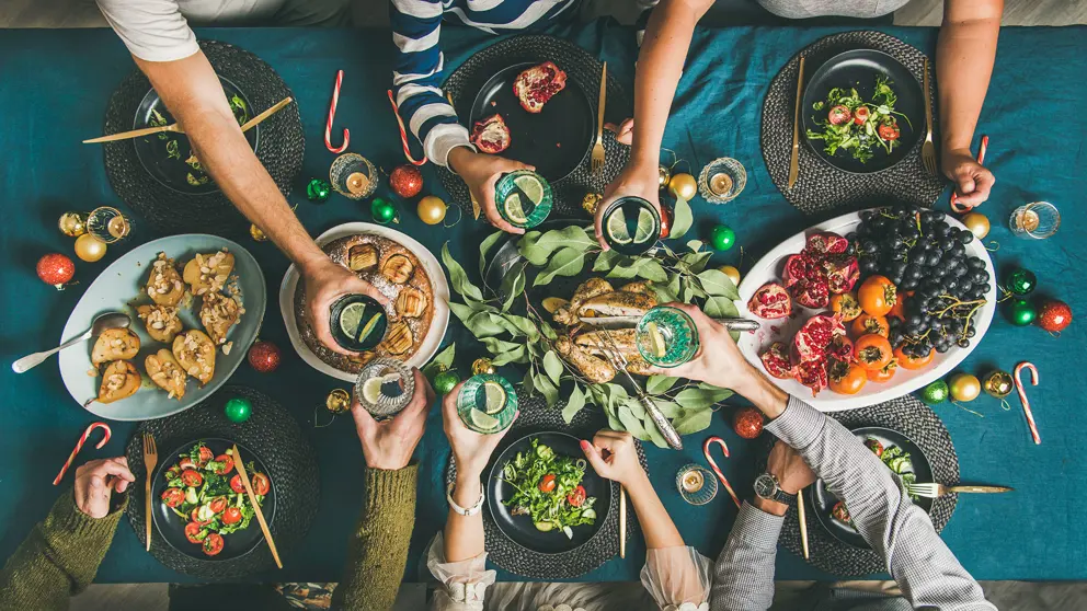 Friends or family celebrating a healthy holiday dinner together