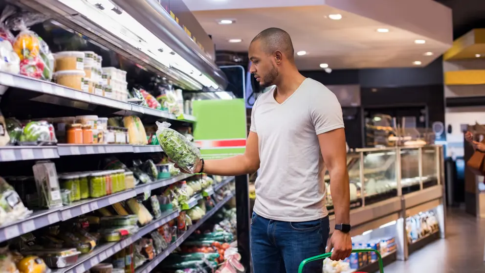 A man shops at a supermarket.