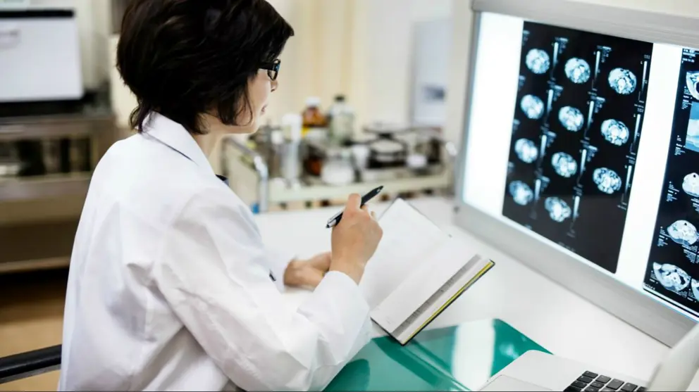 Female doctor examining mri scan in hospital 