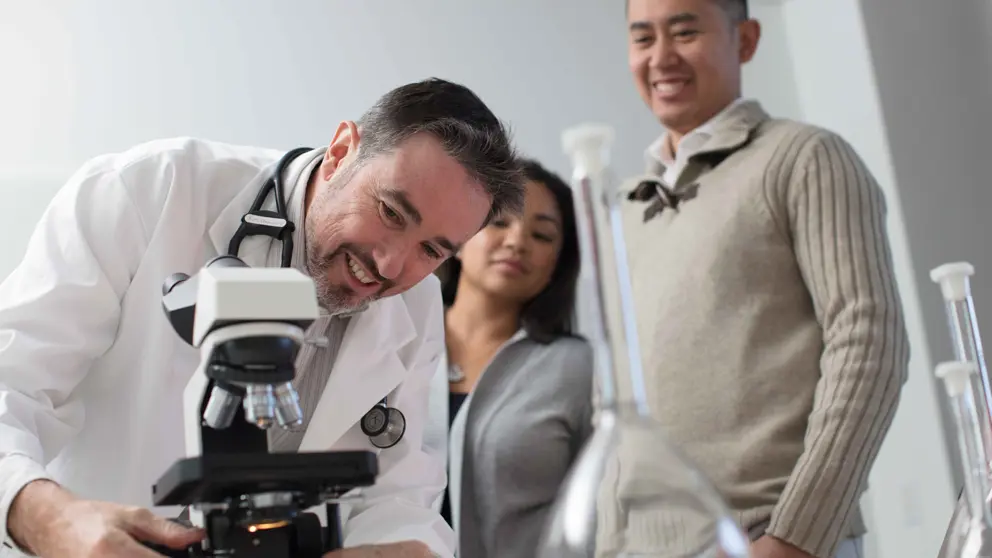 Researcher setting up microscope