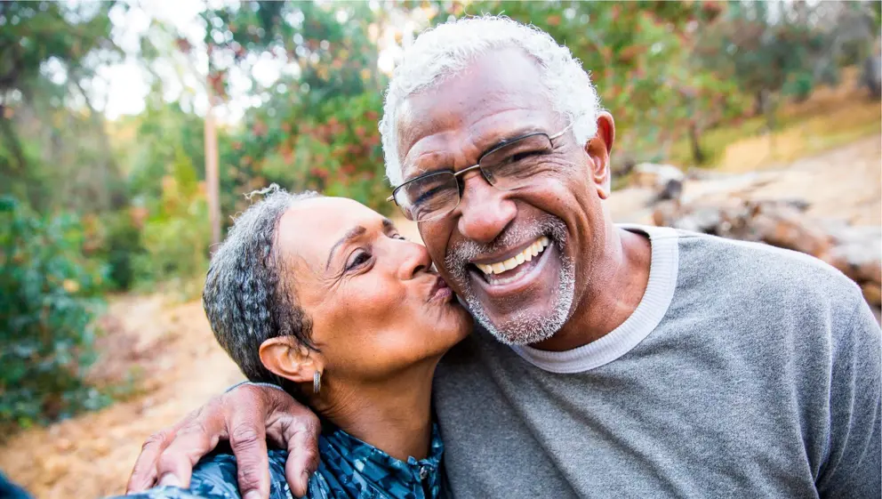 Senior couple taking selfie while exercising