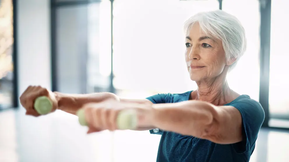 Senior woman lifting weights