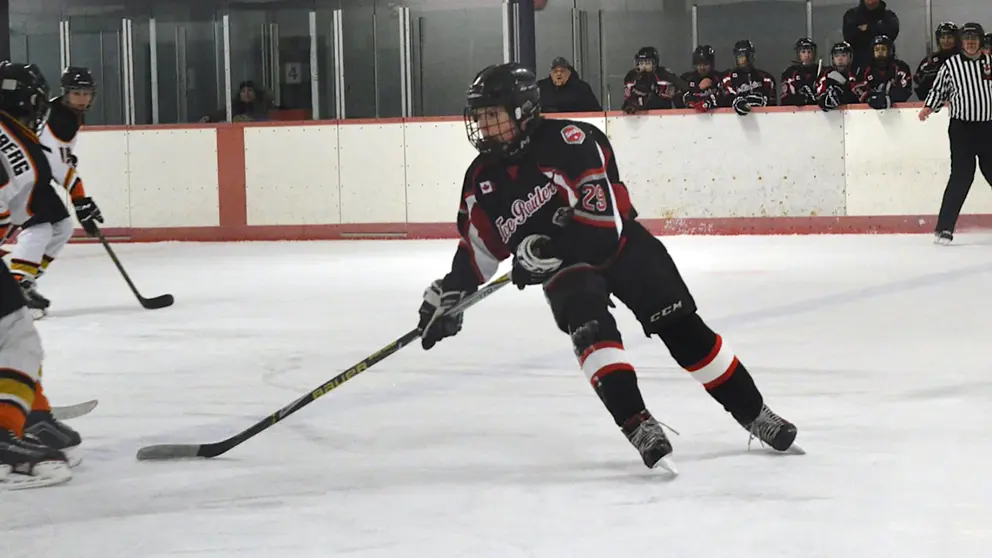 Tobey Lawson playing hockey