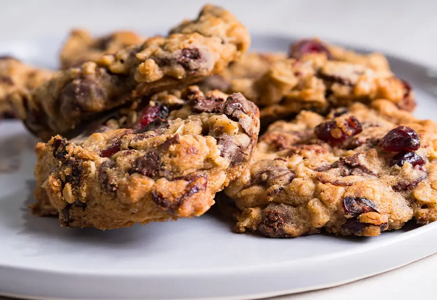 A dish with oatmeal choco-cranberry cookies.